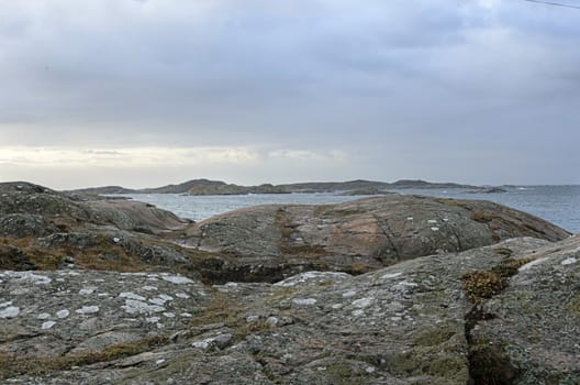 rocks by the sea on a windy and rainy day
