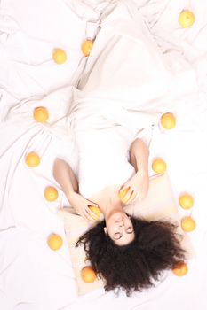 A young south american woman dreaming of fruits.
