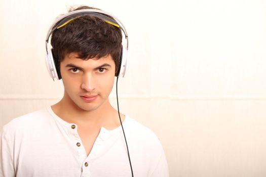 A young, latin man with a headphones
