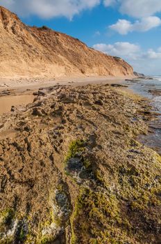 Landscape of the rocky coast, blue sky background