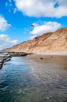 Flying paraglider above the Mediterranean sea in Israel