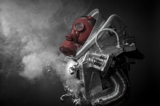 Astronaut with gas mask on a black background with huge weapon.