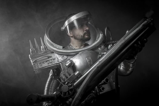 Cosmonaut, Astronaut on a black background with huge weapon.