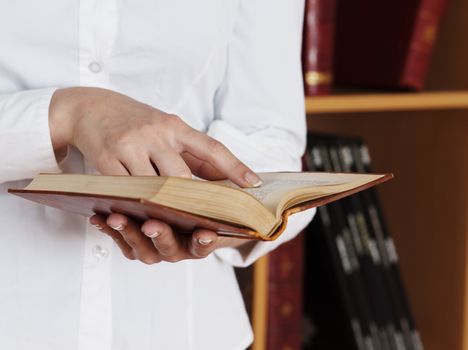 woman hands holding ancient book