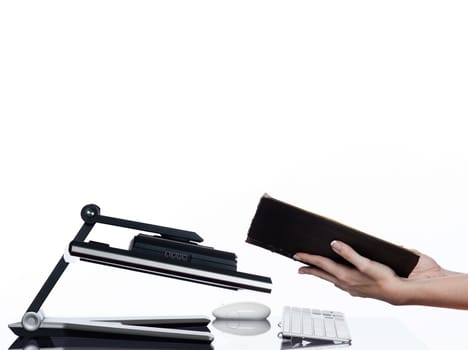 communication between human hand and a computer display monitor on isolated white background expressing book reading concept