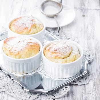 Ruddy cheese cupcakes with icing sugar closeup