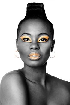 Beautiful face of black African fashion woman with gold makeup cosmetics on white.