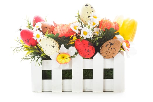 Easter decorations: flowers and eggs isolated on white