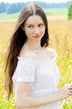 beautiful girl with long hair in field