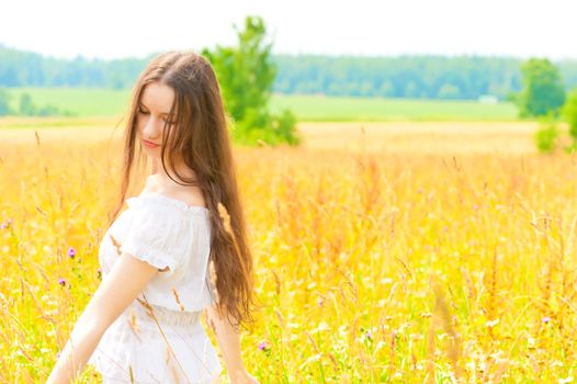 woman with long hair in field