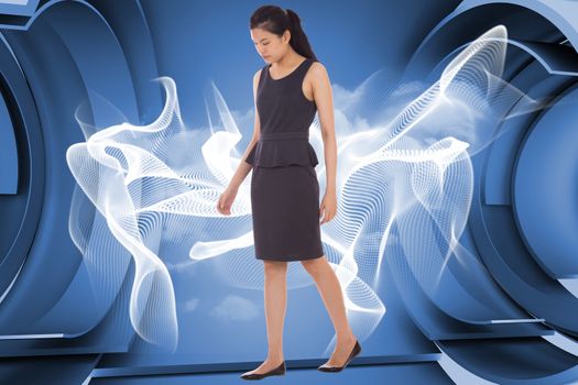 Asian businesswoman walking against abstract linear design in blue and white