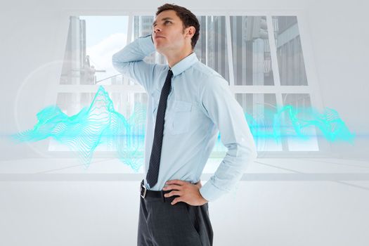 Thinking businessman with hand on head against abstract design in blue