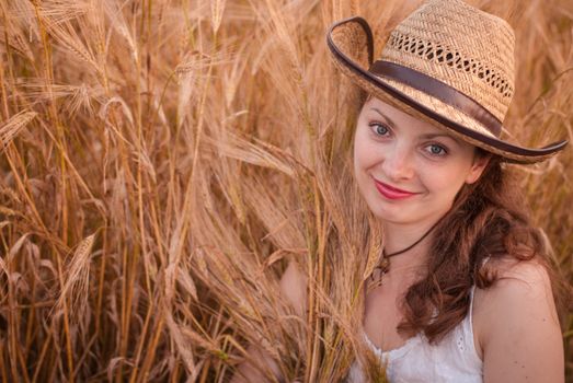 Woman in the wheat field, farmer with crop