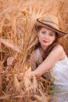 Woman in the wheat field, farmer with crop