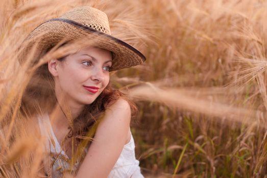 Woman in the wheat field, farmer with crop