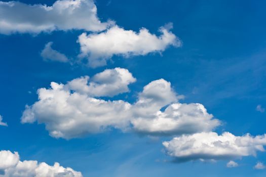 White clouds in blue summer sky background