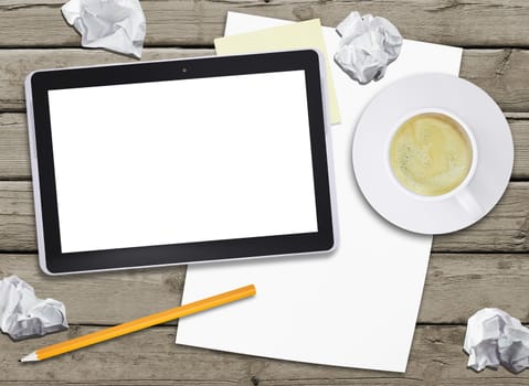 Tablet pc and coffee cup on old wooden boards. Computer technology concept