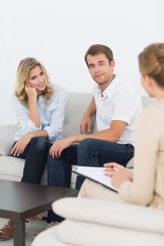 Young couple in meeting with a financial adviser at home