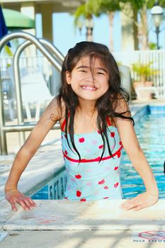 Little girl having fun at the pool
