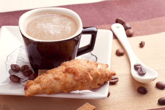 Coffee served with croissant and sfogliatella