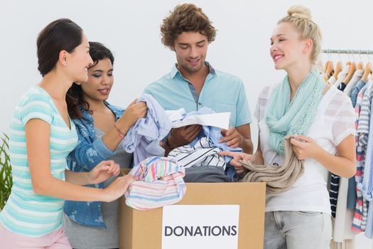Group of young people with clothes donation