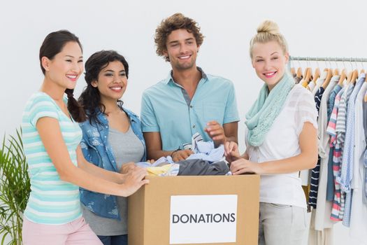 Group of young people with clothes donation