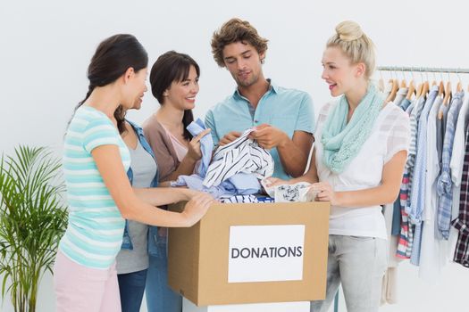 Group of young people with clothes donation