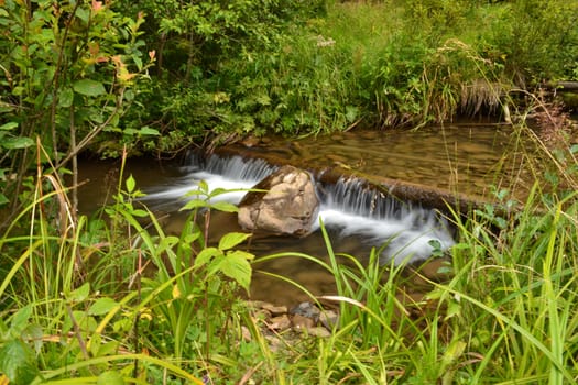 river flows quickly through the stone bottom