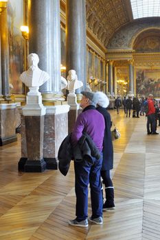 tourists visiting the castle of Versailles