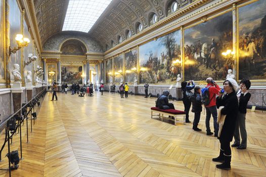 tourists visiting the castle of Versailles