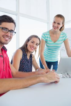 Portrait of young casual people in the meeting room