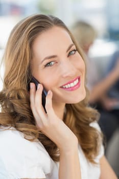 Closeup of a beautiful businesswoman using mobile phone