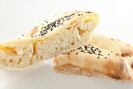 Studio shot of round bread with black seed