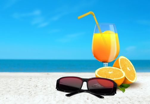 Orange Juice and Sunglasses at the Beach