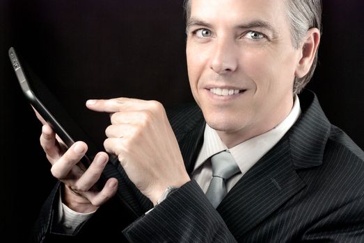 Close-up of a businessman using his tablet