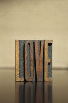 The word LOVE written in vintage letterpress type