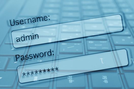 Internet Security Concept - Login Box With Filled-in Username and Password in Internet Browser. Computer Keyboard in Background.