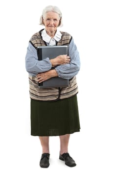 Senior woman holding laptop computer isolated on white background