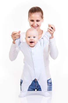 Happy young Caucasian woman and her baby son over white