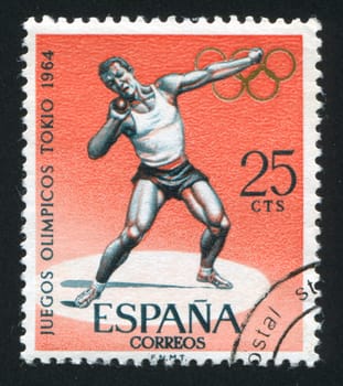 SPAIN - CIRCA 1964: stamp printed by Spain, shows Olympic Athlete, Shot Put, circa 1964
