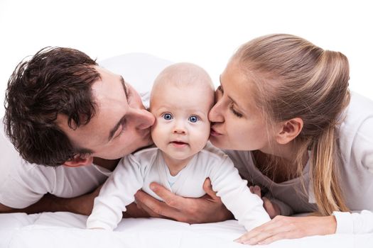 Closeup of young family with baby boy against white background