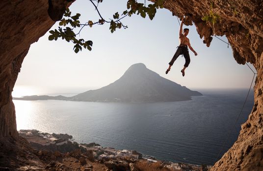 Rock climber at a sunset. Kalymnos Island, Greece.