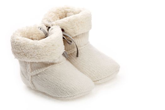 Pair of baby booties isolated over white background