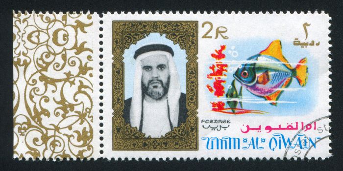 UMM AL-QUWAIN - CIRCA 1972: stamp printed by Umm al-Quwain, shows Sheikh and Fish, circa 1972