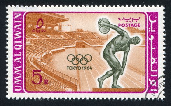 UMM AL-QUWAIN - CIRCA 1964: stamp printed by Umm al-Quwain, shows Stadium and Discobolus, circa 1964