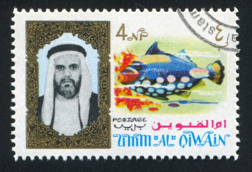 UMM AL-QUWAIN - CIRCA 1972: stamp printed by Umm al-Quwain, shows Sheikh and Fish, circa 1972