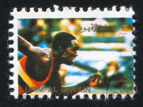 UMM AL-QUWAIN - CIRCA 1972: stamp printed by Umm al-Quwain, shows a Runner, circa 1972