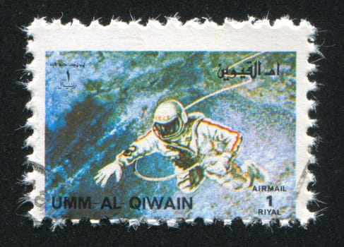 UMM AL-QUWAIN - CIRCA 1972: stamp printed by Umm al-Quwain, shows Alexei Leonov spacewalking during Voskhod 2, circa 1972