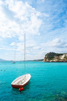 Altea Mediterranean sea detail with sailboat in alicante Spain