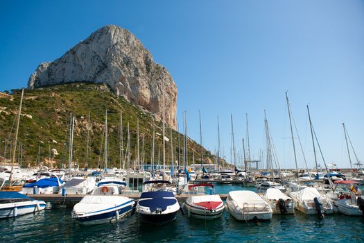 Calpe Alicante marina boats with Penon de Ifach mountain in Mediterranean sea of Spain